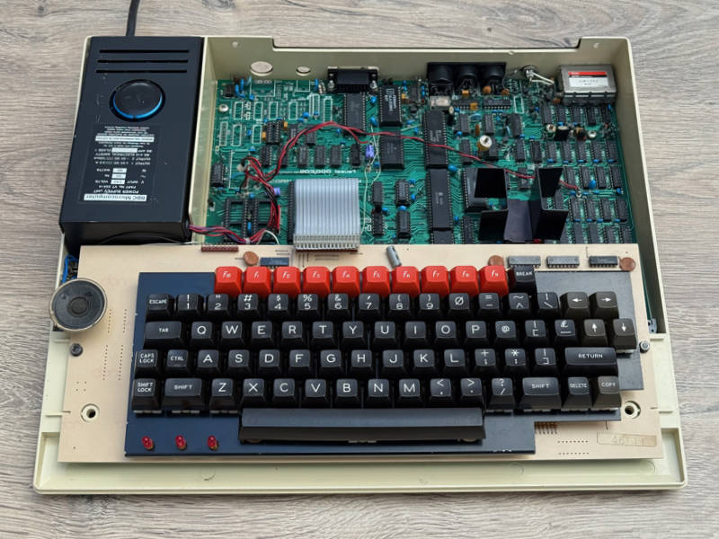Some enthusiasts used their BBC Micros in this state — lid off gives easy access for changing ROMs.