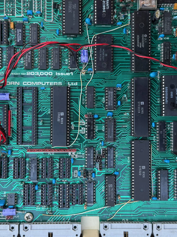 IC76 (lower left) ROM select latch is absent on a Model A but soldered to this PCB — more evidence this was built as a Model B.