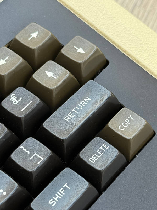 Texture worn off the Return key shows that this machine had plenty of use.